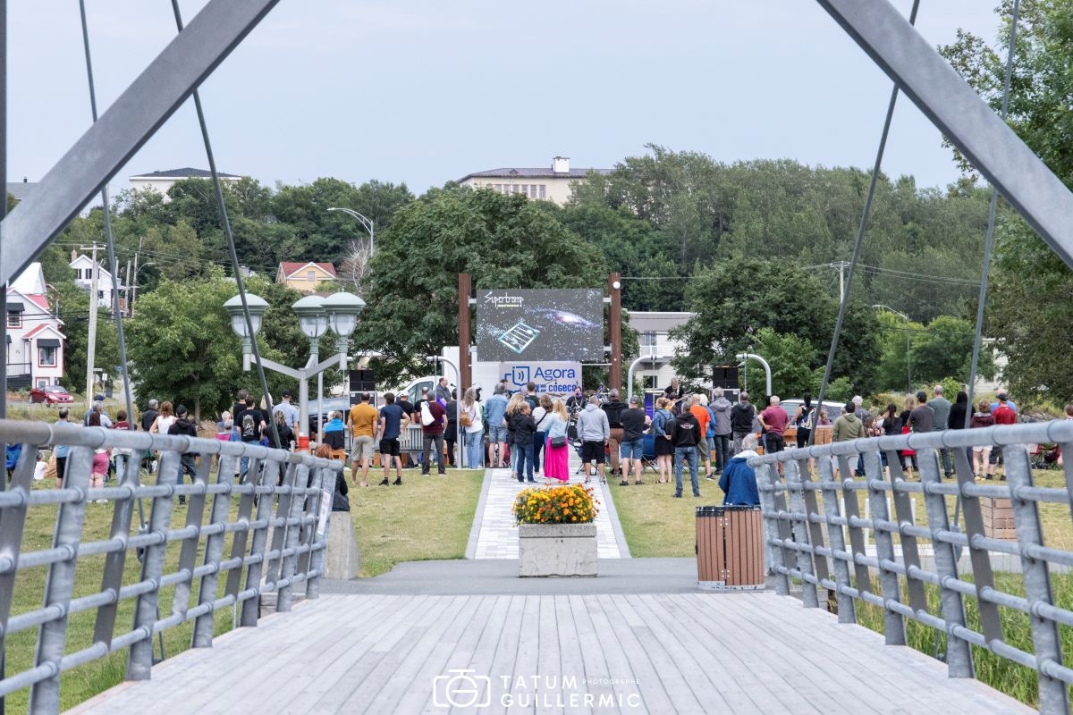 The Cogeco Agora - A stage and an outdoor screen in a magical setting.